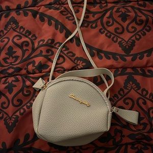 Small gray purse. Never worn. Cross body or worn in hand.